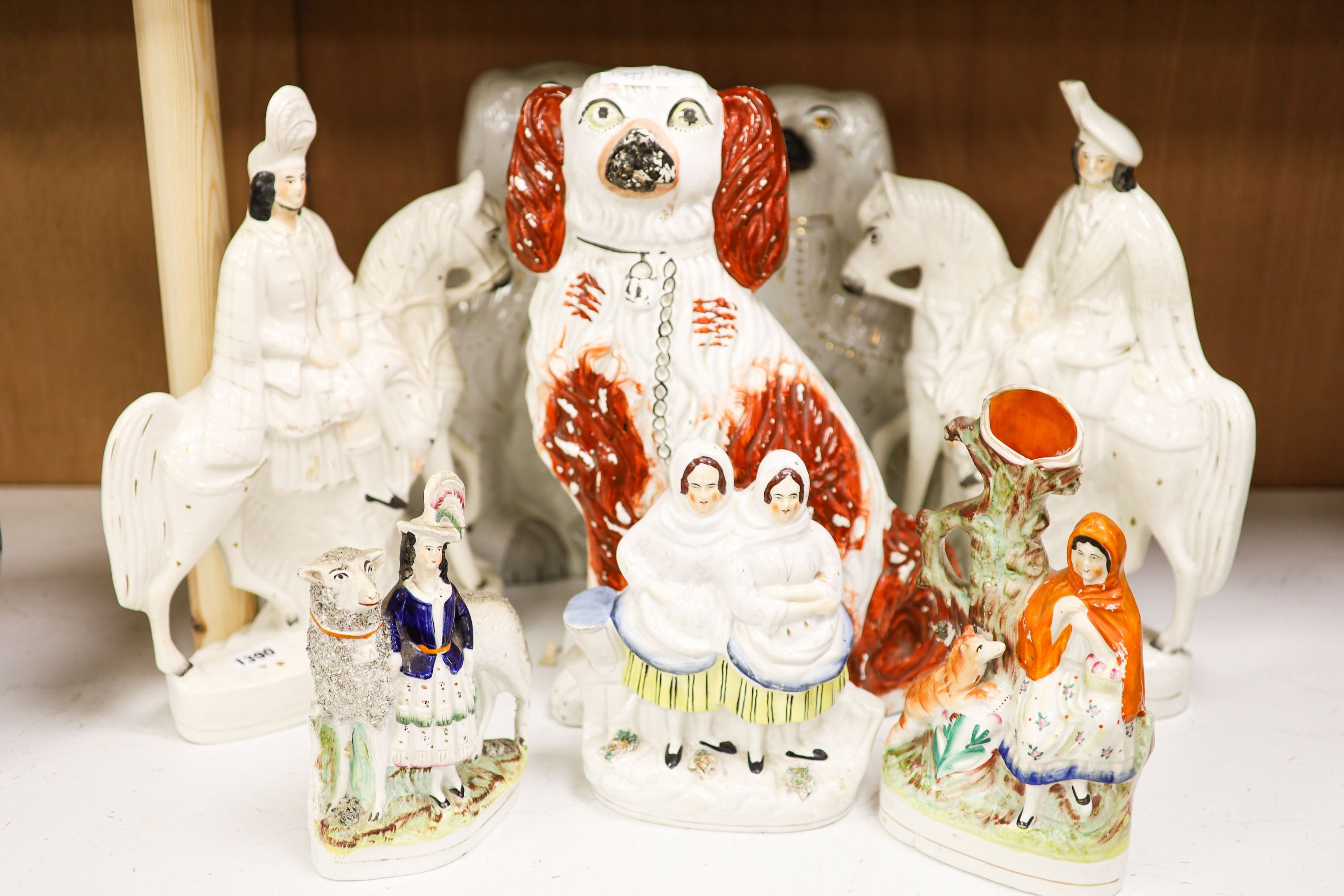 Eight Victorian Staffordshire pottery groups or figures